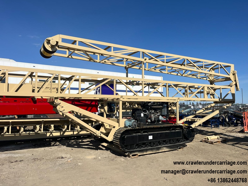 Customized tracked undercarriage integrated with heavy steel conveyor frame, custom rubber track chassis solution.