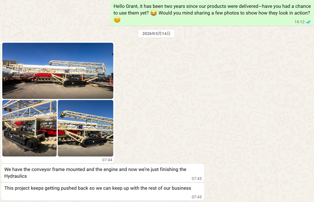 WhatsApp chat with Canadian client showing a massive custom manufactured steel crawler undercarriage integrated with a complex conveyor system frame. Text confirms hydraulic installation.